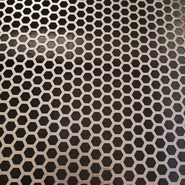 Perforated metal sheet with precision-drilled holes for efficient filtration ventilation and design accents