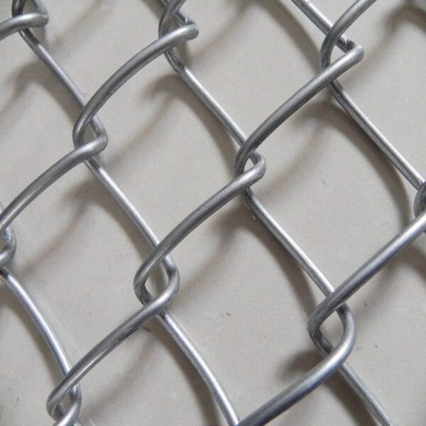 Robust industrial chain link fencing offering strong barrier and visibility for safety and security applications